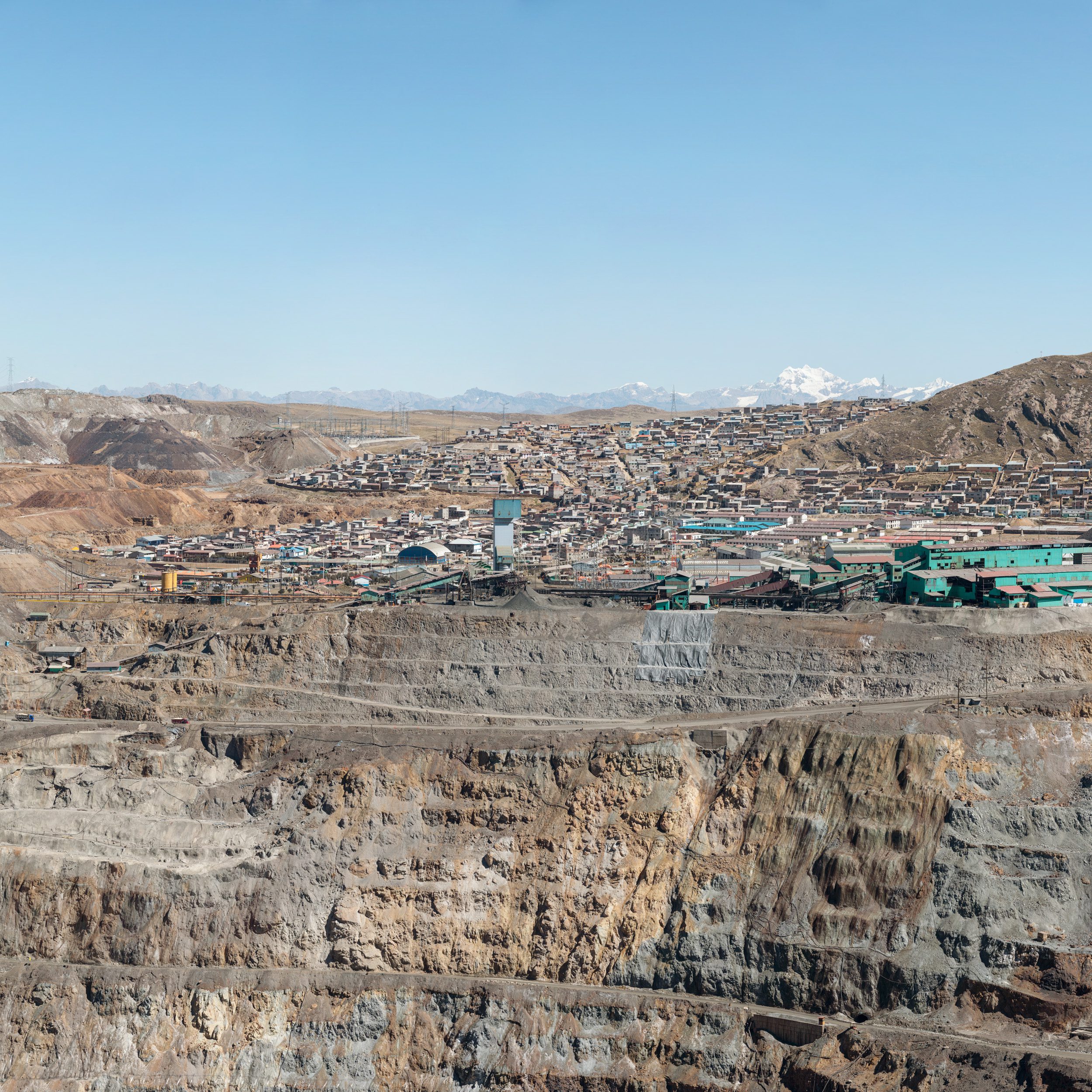 Mountain town above a gaping hole in the earth